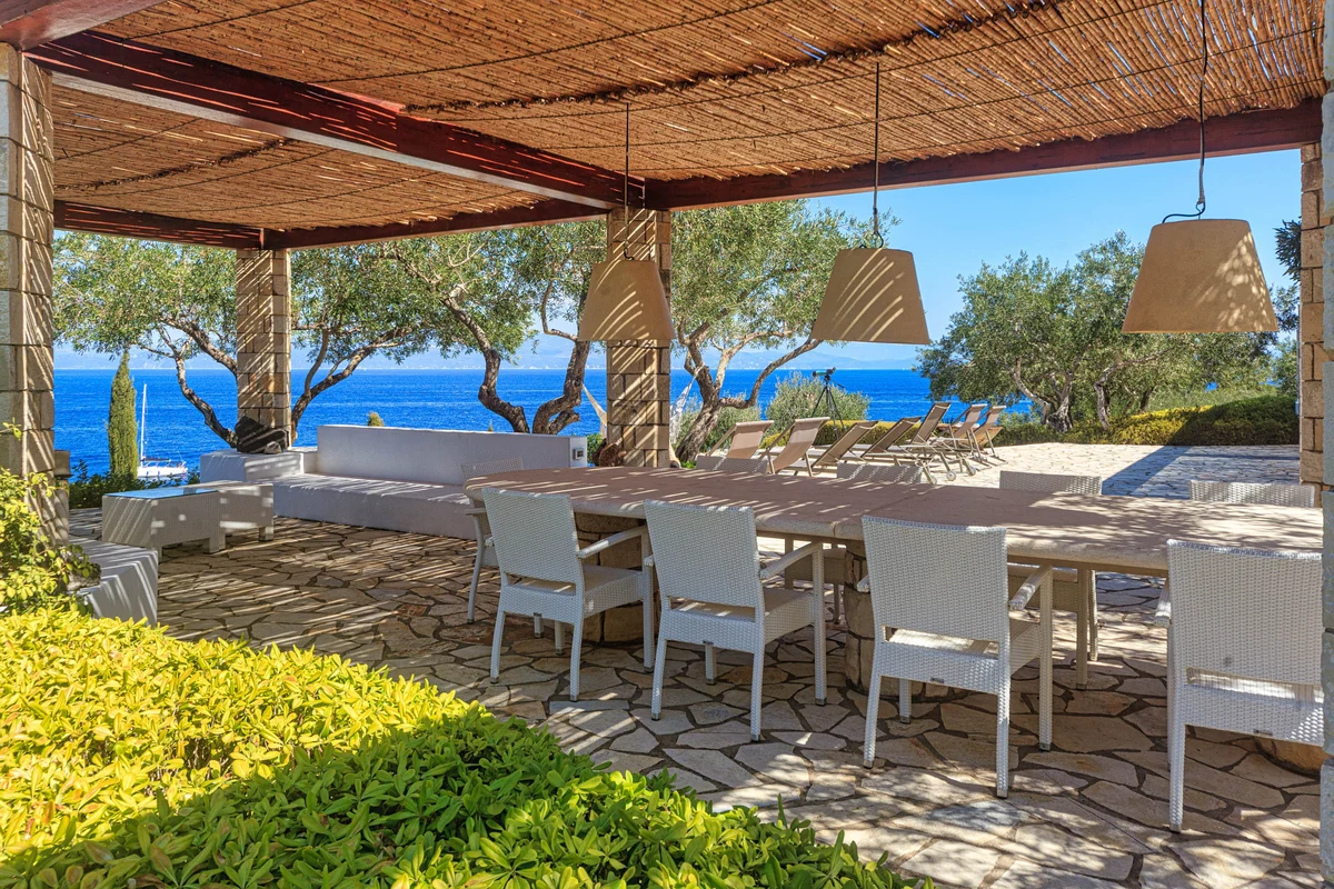 A shaded stone terrace open to the sea
